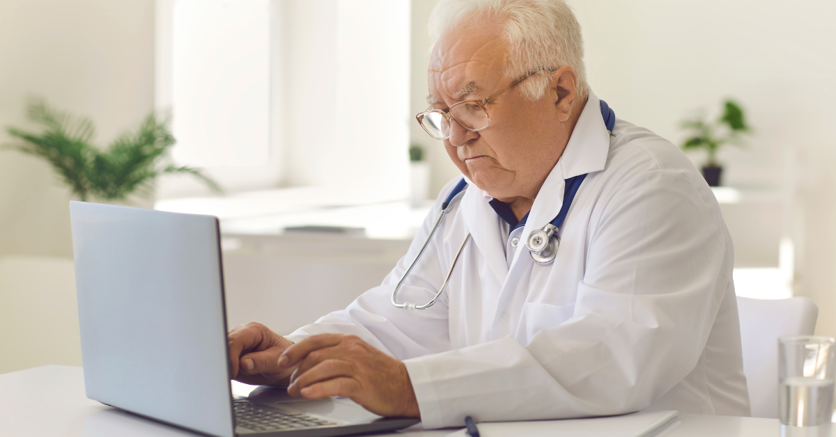 electronic health record sample on screen in front of doctor