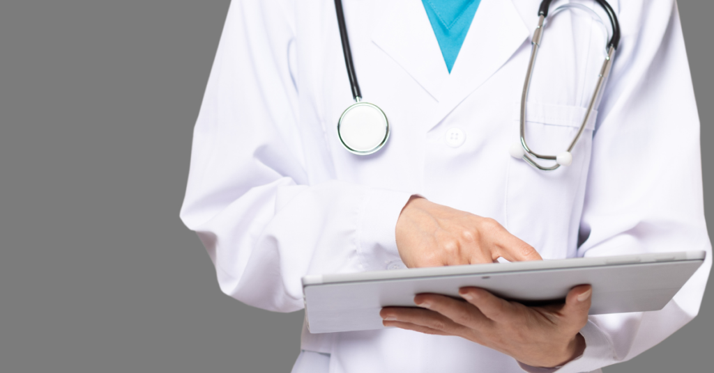 electronic medical record cerner held by a female doc