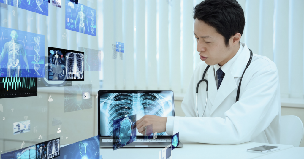 electronic medical record programs on the wall with a doc sitting nearby