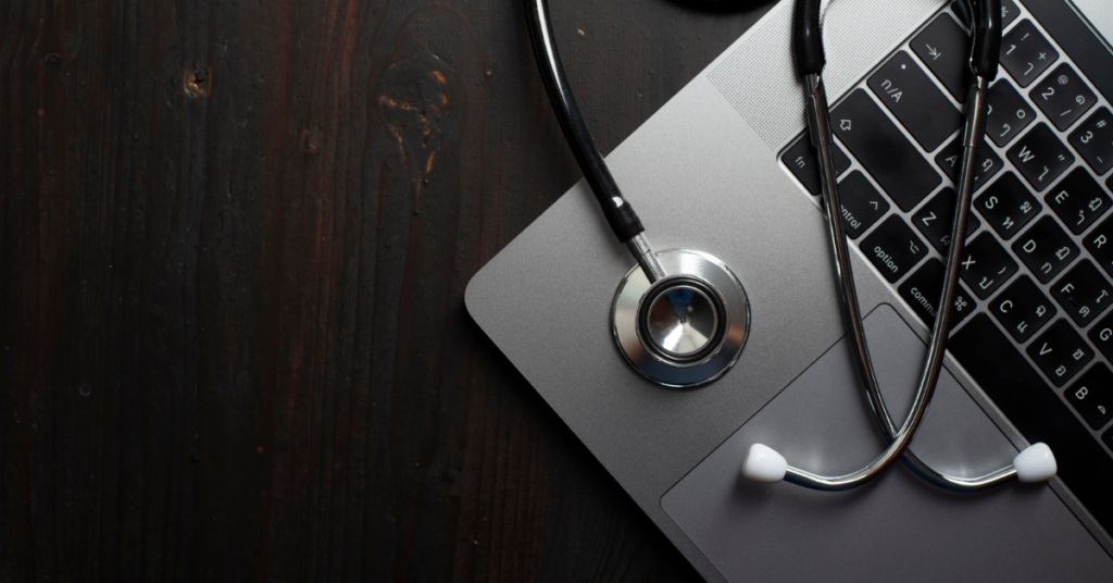 electronic medical records benefits depicted by a stethoscope on a laptop