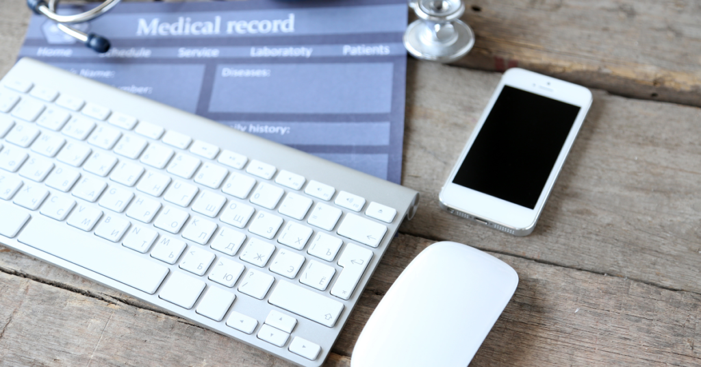 electronic medical records meaning shown with medical still life with keyboard