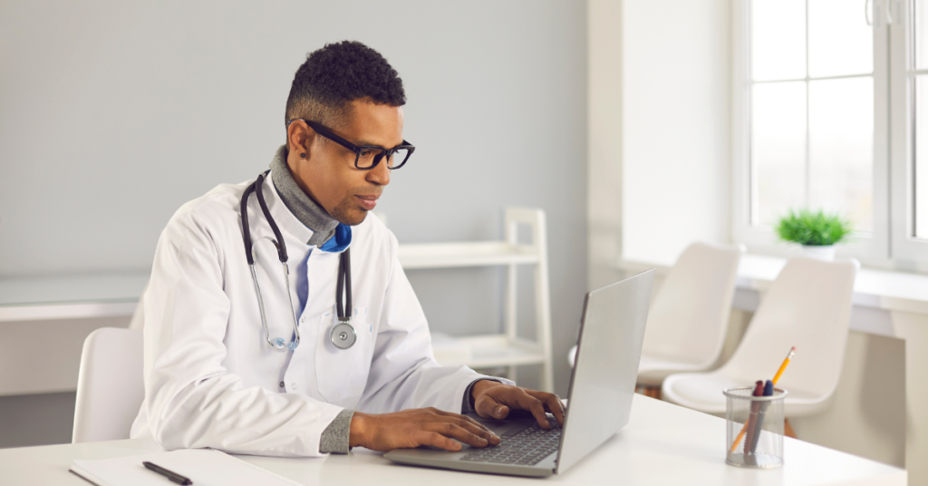 electronic medical records programs looked at by a doc in white coat