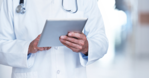 examples of electronic medical records in hands of doc in a tablet