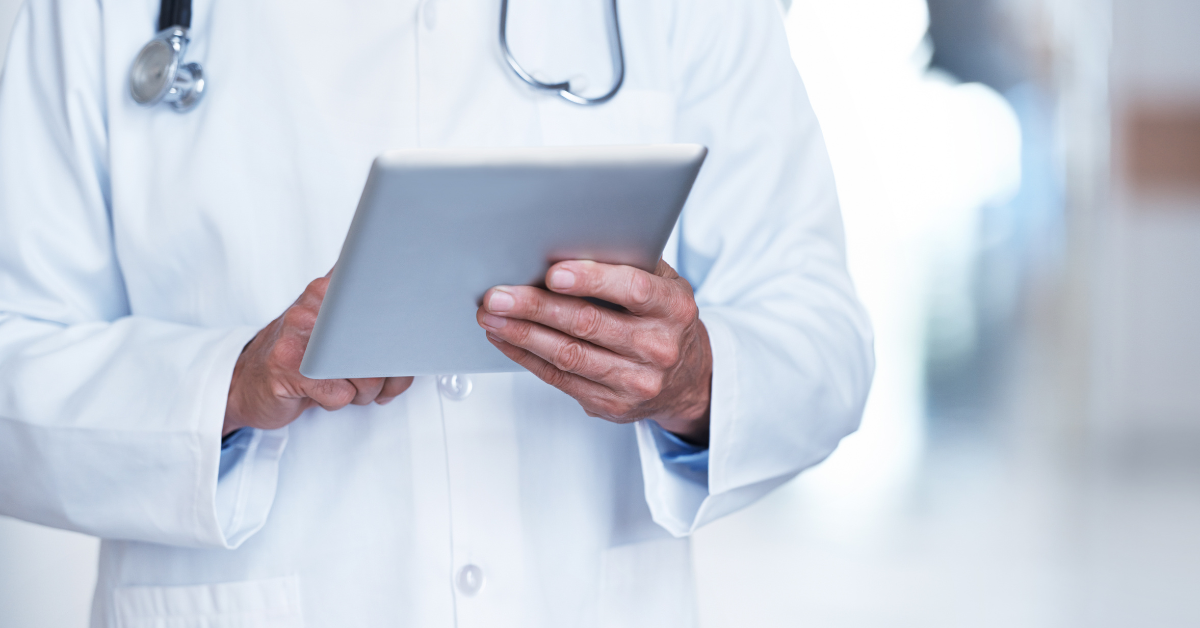 examples of electronic medical records in hands of doc in a tablet