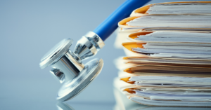examples of medical records with a stethoscope on top