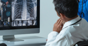 sample electronic health record on screen with doc looking at it